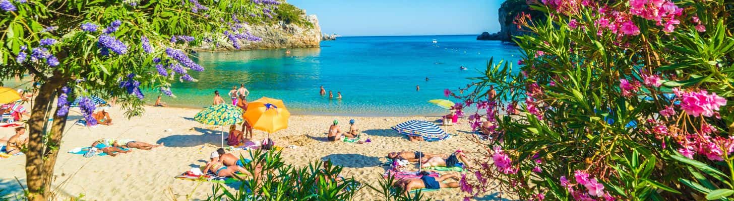 People relaxing on the beach in Corfu