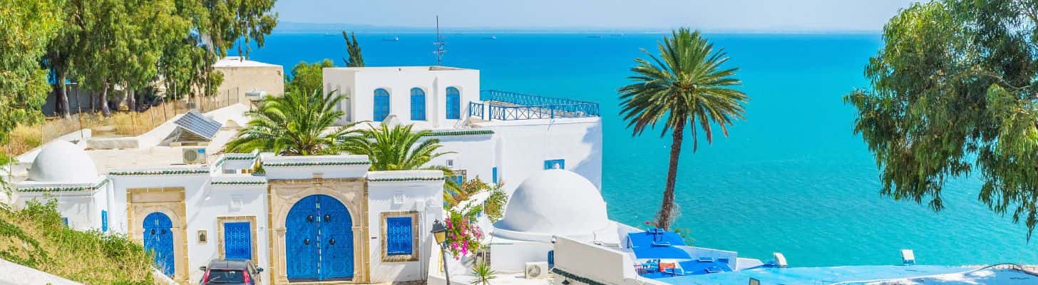 Traditional Tunisian house against turquoise sea