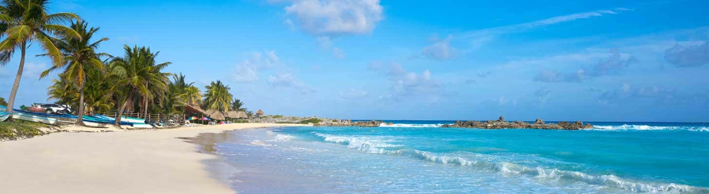 Golden sands & turquoise waters on a beach in Cozumel, Mexico