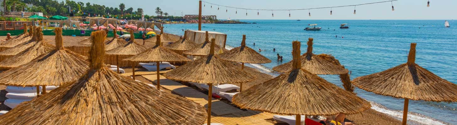 Sun umbrellas on Lara Beach in Antalya, Turkey