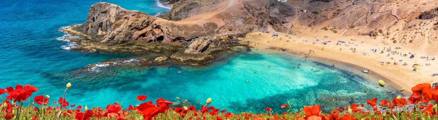 Sandy beach & clear waters of Papagayo beach in Lanzarote