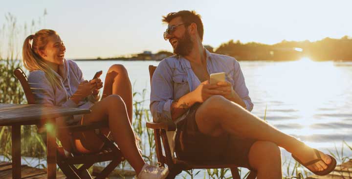 Couple sitting by a lake