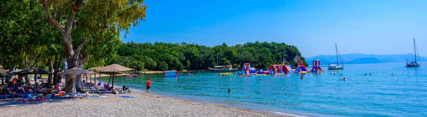 Holidaymakers on the beach at Dassia, Corfu