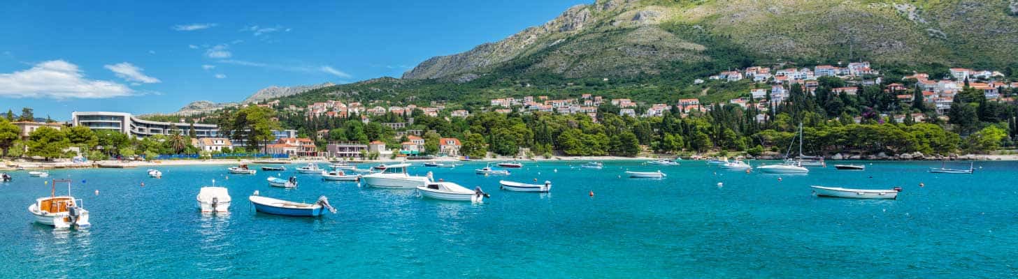 Boats in the blue sea by the resort of Mlini, Croatia